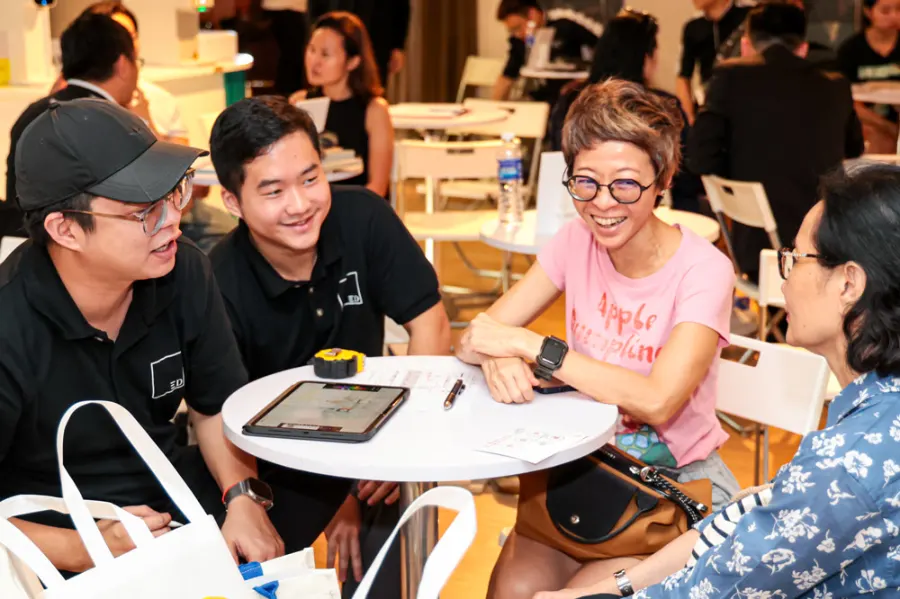 Homeowners laughing with an interior designer