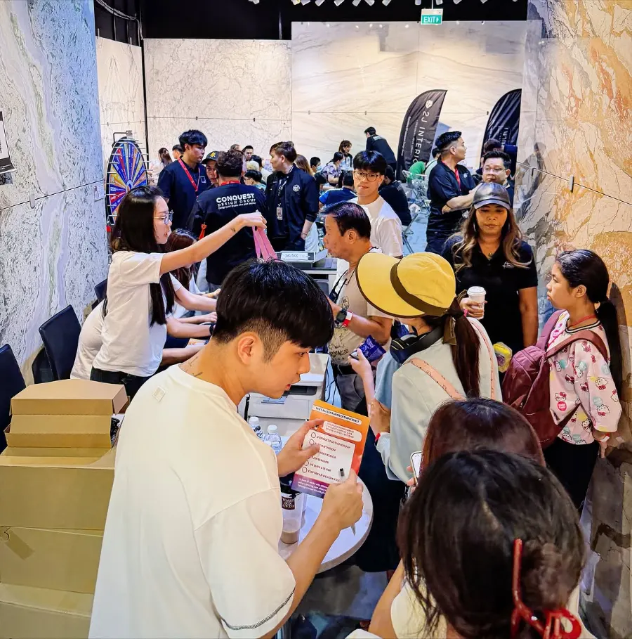 Homeowners at registration with the prize wheel behind